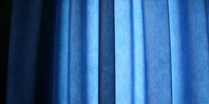 Full Frame Shot Of Blue Curtain At Home