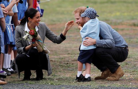 Prince Harry, Duke of Sussex and Meghan, Duchess of Sussex interact with Luke Vincent, 5 after arriving at Dubbo Airport on October 17, 2018 in Dubbo, Australia. The Duke and Duchess of Sussex are on their official 16-day Autumn tour visiting cities in Australia, Fiji, Tonga and New Zealand.