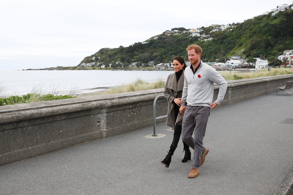 wellington, new zealand   october 29  prince harry, duke of sussex and meghan, duchess of sussex walking along lyall bay to visit maranui cafe on october 29, 2018 in wellington, new zealand the duke and duchess of sussex are on their official 16 day autumn tour visiting cities in australia, fiji, tonga and new zealand  photo by chris jacksongetty images