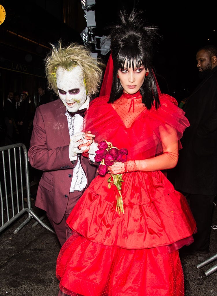 bella hadid and singer the weeknd dressed as beetlejuice and lydia