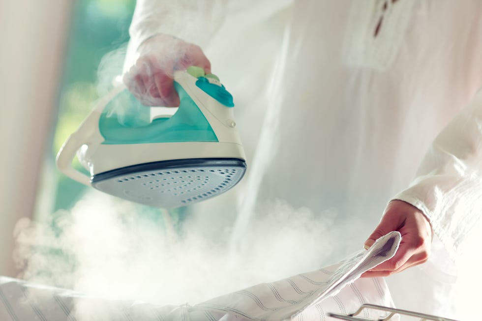 steam iron being used on a garment