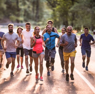 Full length of marathon runners having a race through nature. tapasciate, corse non competitive, running, corsa, runner
