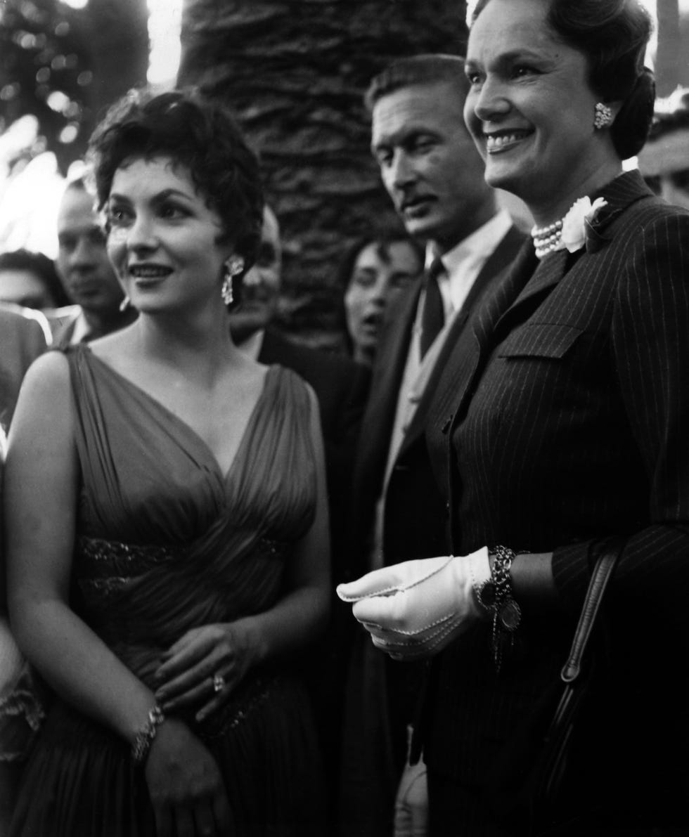 the italian actress gina lollobrigida left with the begum, wife of aga khan, during a garden party of the italian film delegation on the occasion of the film festival in cannes photograph taken in 1955 photo georg göbel dpa  usage worldwide photo by georg göbelpicture alliance via getty images