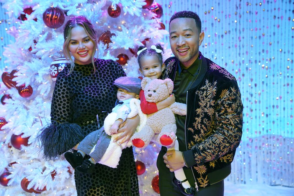 Chrissy Teigan and John Legend with their children Miles (L) and Luna (R) in 2018