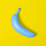 blue banana on yellow background