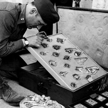 germany may 18 on may 18, 1945, first lieutnant james j rorimer, curator at the metropolitan museum of new york taking a look at a jewellery collection of the 16th c stolen by the nazis from the rothschild family in paris this is in the cellars of the castle of neuschwanstein goering despoiled families all over europe to make up a museum photo by keystone francegamma keystone via getty images