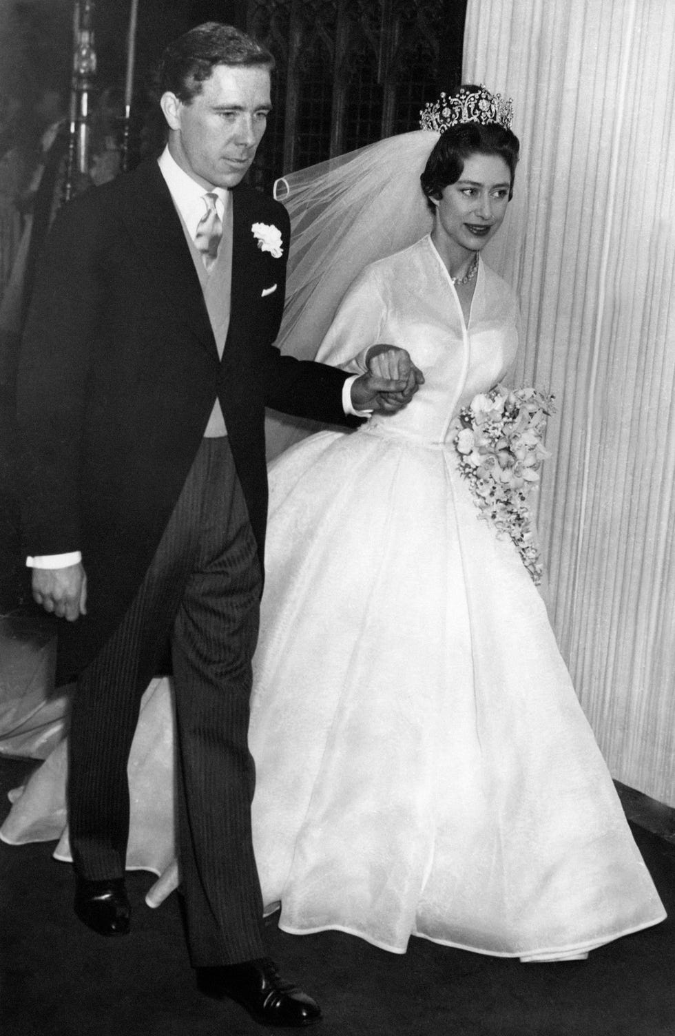 Wedding dress, Photograph, White, Gown, Facial expression, Dress, Suit, Formal wear, Bride, Bridal clothing, 