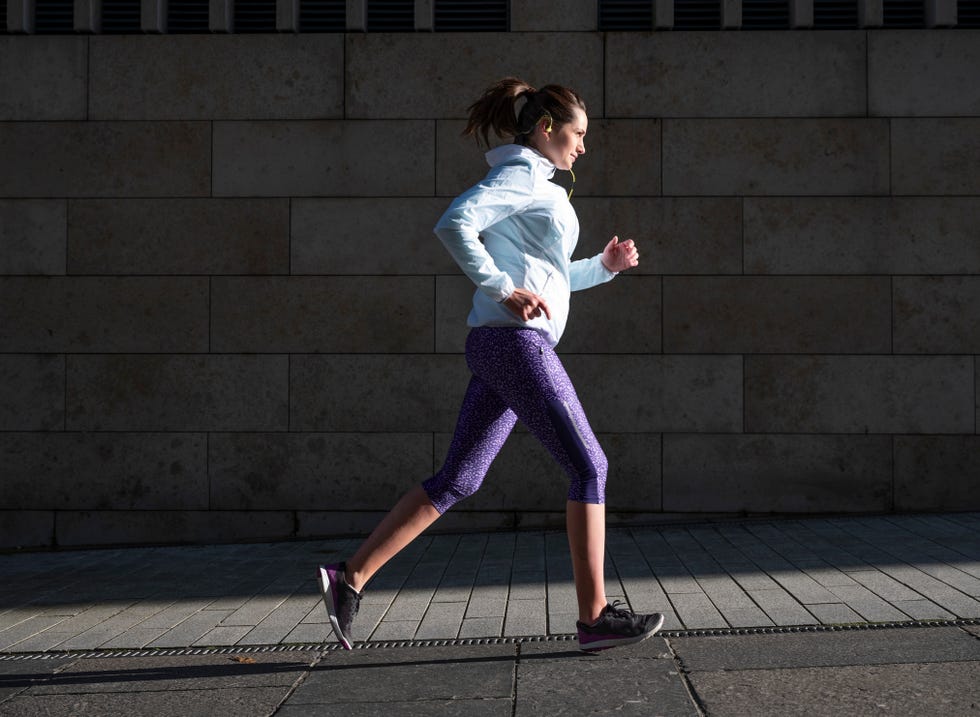 woman running outdoors early in the morning.