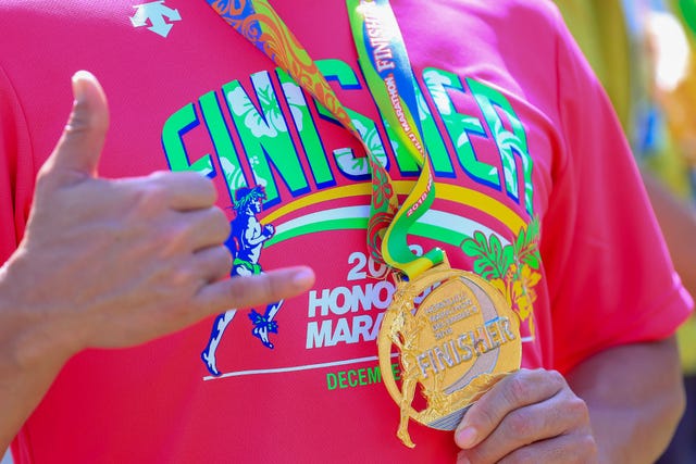 honolulu, hi december 09 finisher medal and t shirt of the honolulu marathon 2018 on december 9, 2018 in honolulu, hawaii photo by tom penningtongetty images for honolulu marathon