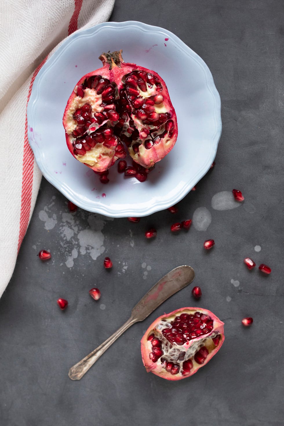 Pomegranate fruit on black textured background