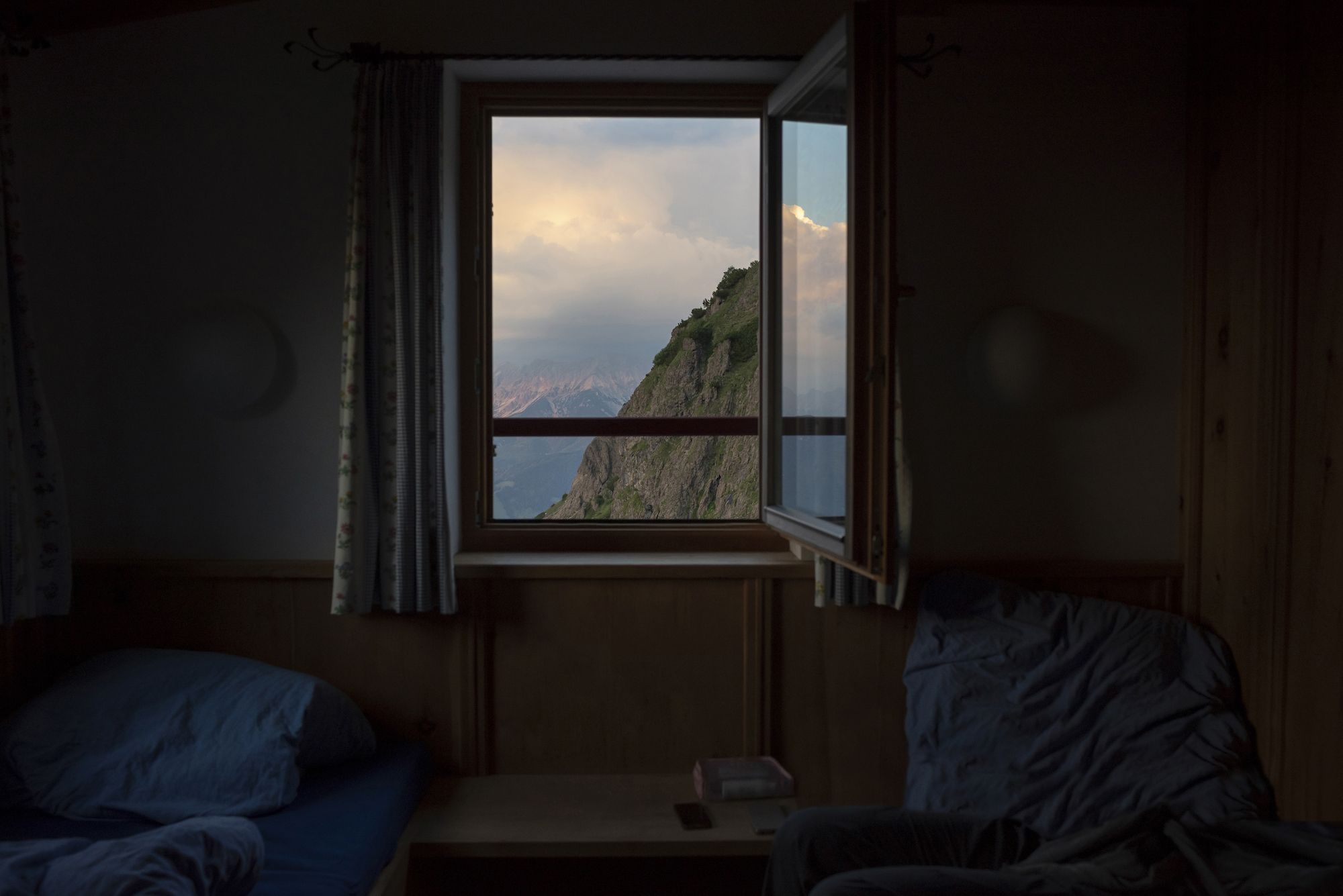 Austria, Tyrol, Fieberbrunn, view out of bedroom of a mountain hut on mountain