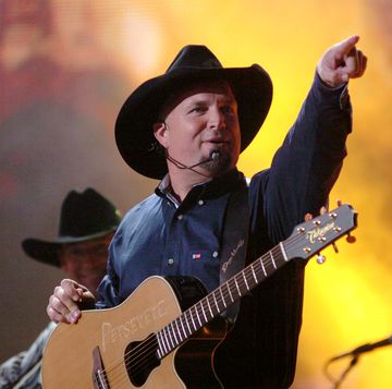 garth brooks performs good ride cowboy during the 39th annual cma awards   garth brooks performs in times square at times square in new york city, new york, united states photo by j kempinfilmmagic