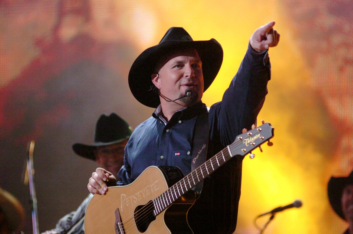 Country artist Garth Brooks throws out the first pitch prior to a News  Photo - Getty Images