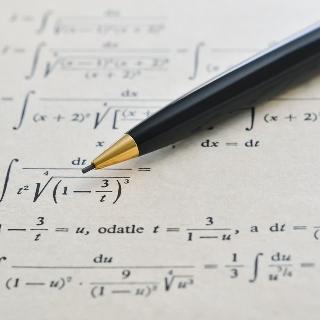 pencil over a math book and advanced example with integrals