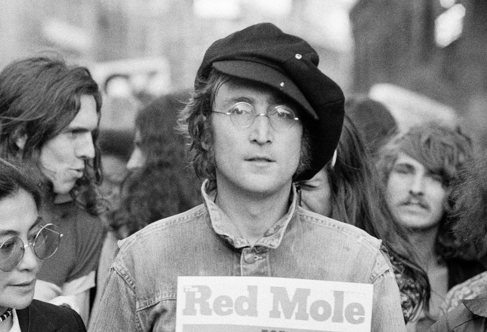 portrait of british musician john lennon 1940   1980 center and his wife, artist and musician yoko ono extreme left as they attend an unspecified rally in hyde park, london, england, 1975  photo by rowland schermangetty images