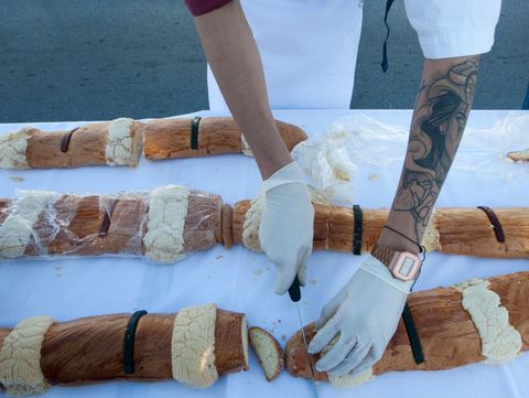 a student of gastronomy takes part in breaking the guinness world record by making a 2063,43 metre king cake, the longest in the world, in saltillo, coahuila state, mexico, on december 6, 2019 photo by julio cesar aguilar  afp        photo credit should read julio cesar aguilarafp via getty images