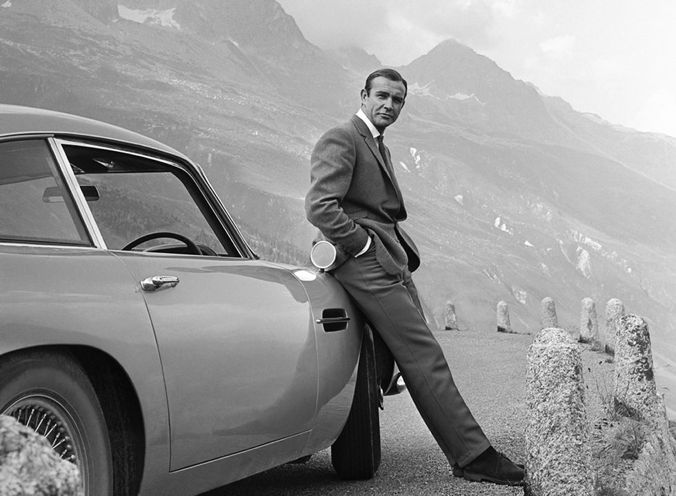1964  actor sean connery poses as james bond next to his aston martin db5 in a scene from the united artists release goldfinger in 1964  photo by michael ochs archivesgetty images