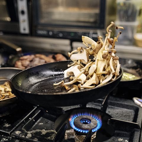 Pan frying mushrooms.