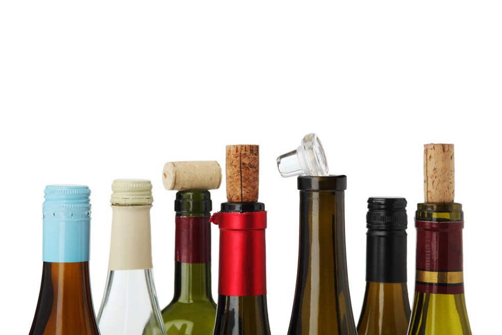 from left to right wine bottles with screw tops, corks, glass enclosure, cork﻿