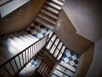 staircase inside an old residential building in catania, italy