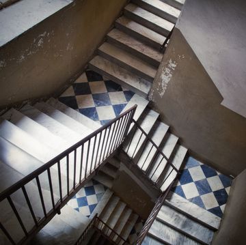 staircase inside an old residential building in catania, italy