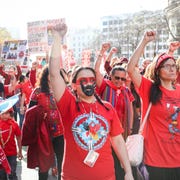 This is an image red dress day activists