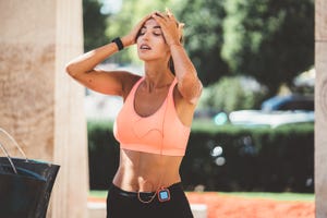 young woman cooling with water after sports training