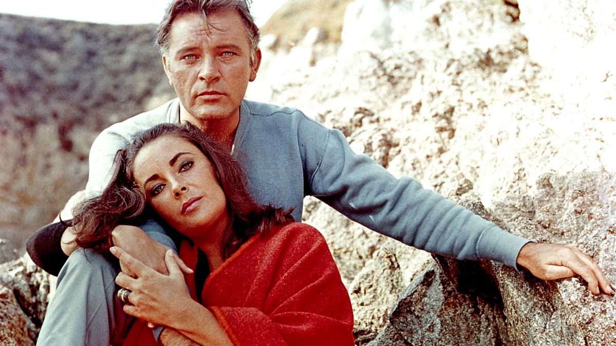Elizabeth Taylor and Richard Burton on the film set of "The Sandpiper" in 1965.