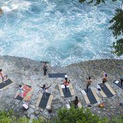 Mexico, Mismaloya, instructor with yoga class at ocean front