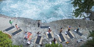Mexico, Mismaloya, instructor with yoga class at ocean front