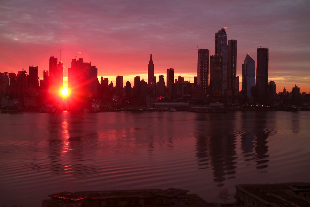 weehawken, nj   january 12 the sun rises down 42nd street during a manhattanhenge sunrise in new york city on january 12, 2018 as seen from weehawken, new jersey photo by gary hershorngetty images
