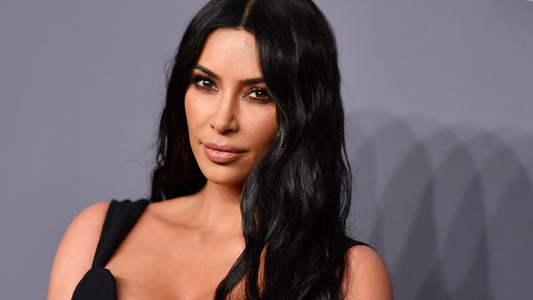 Kim Kardashian barely covers her boobs in tiny bandeau top and