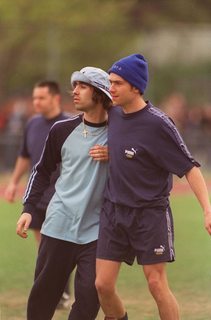 liam gallagher, singer and guitarist with the british pop group oasis with damon albarn, singer with the british pop group blur, seen taking part in the music industry soccer six tournament at mile end stadium, east london photo by avalongetty images