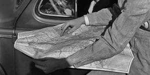 a gas station attendant showing a location on a map to a woman driver circa 1950 photo by keystone viewfpggetty images