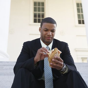 man not excited about a sandwich