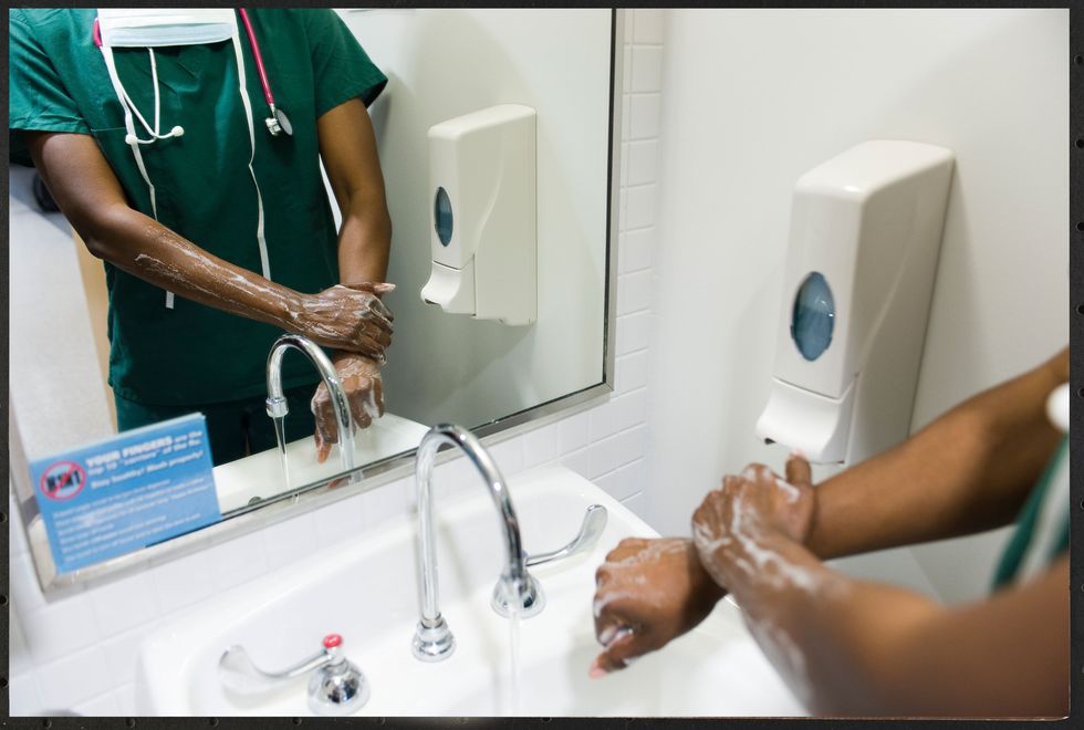 Healthcare worker washing hands.