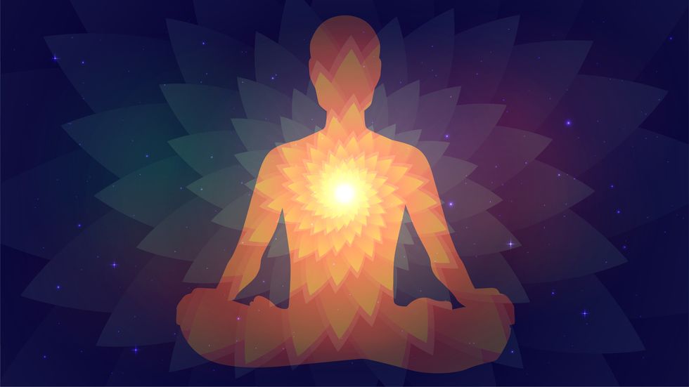 silhouette of human sitting in the lotus position on fractal background meditation, yoga, trans