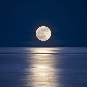 seattle, san juan islands giant moonrise over salish sea
