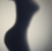 Silhouette of naked woman's body behind glass door. Concept silhouette of naked womans body behind glass door concept