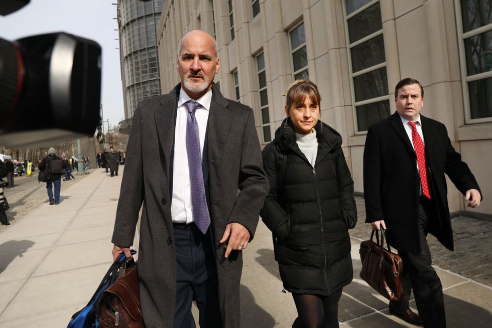 new york, new york   february 06 actress allison mack leaves the brooklyn federal courthouse with her lawyers after a court appearance surrounding the alleged sex cult nxivm on february 06, 2019 in new york city along with clare bronfman, heiress of the seagram’s liquor empire, mack and other defendants were arrested last year and accused of having helped operate a criminal enterprise for self help guru keith raniere, who has been charged with sex trafficking photo by spencer plattgetty images