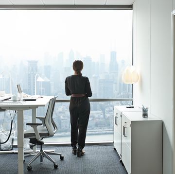 elegant businesswoman working alone in office building