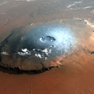 illustration looking down on the olympus mons shield volcano on mars, viewing to the west, from an approximate altitude of 350 kilometres ice white lies on its upper slopes that tower 24 kilometres above the surrounding plain steep cliffs surround the volcano, rising a sheer 10 kilometres shield volcanoes are flat, and olympus mons is a massive 600 kilometres across and is the largest mountain in the solar system the topography of this artwork was created with 3ds max software, using data from the laser altimeter on the mars global surveyor probe