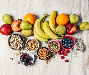 variety of fruits and nuts on gray background