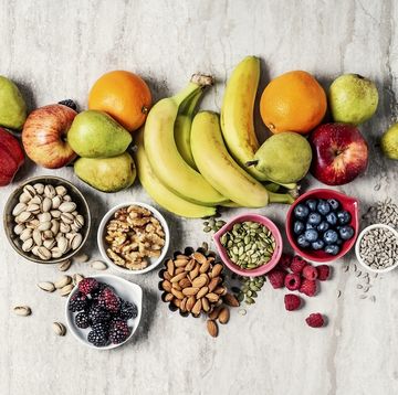 variety of fruits and nuts on gray background