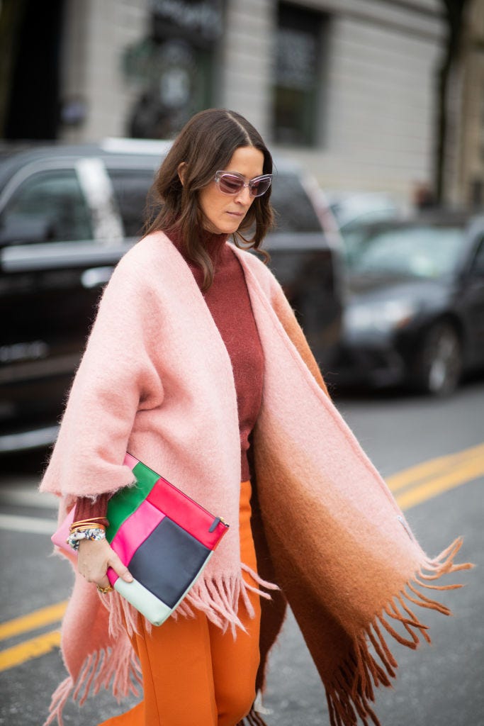 new york, new york   february 11 a guest is seen wearing scarf worn as cape outside carolina herrera during new york fashion week autumn winter 2019 on february 11, 2019 in new york city photo by christian vieriggetty images