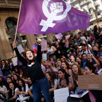 a woman waves a feminist flag as student protesters shout slogans during a demonstration marking international womens day in barcelona on march 8, 2019 unions, feminist associations and left wing parties have called for a work stoppage for two hours on march 8, hoping to recreate the strike and mass protests seen nationwide to mark the same day in 2018 photo by pau barrena afp photo by pau barrenaafp via getty images