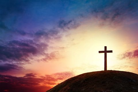 silhouette cross on calvary mountain sunset background easter concept