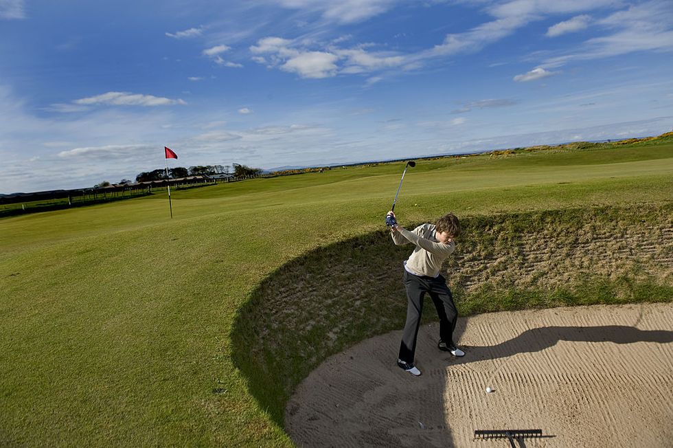 A student at St. Andrews's Old Course