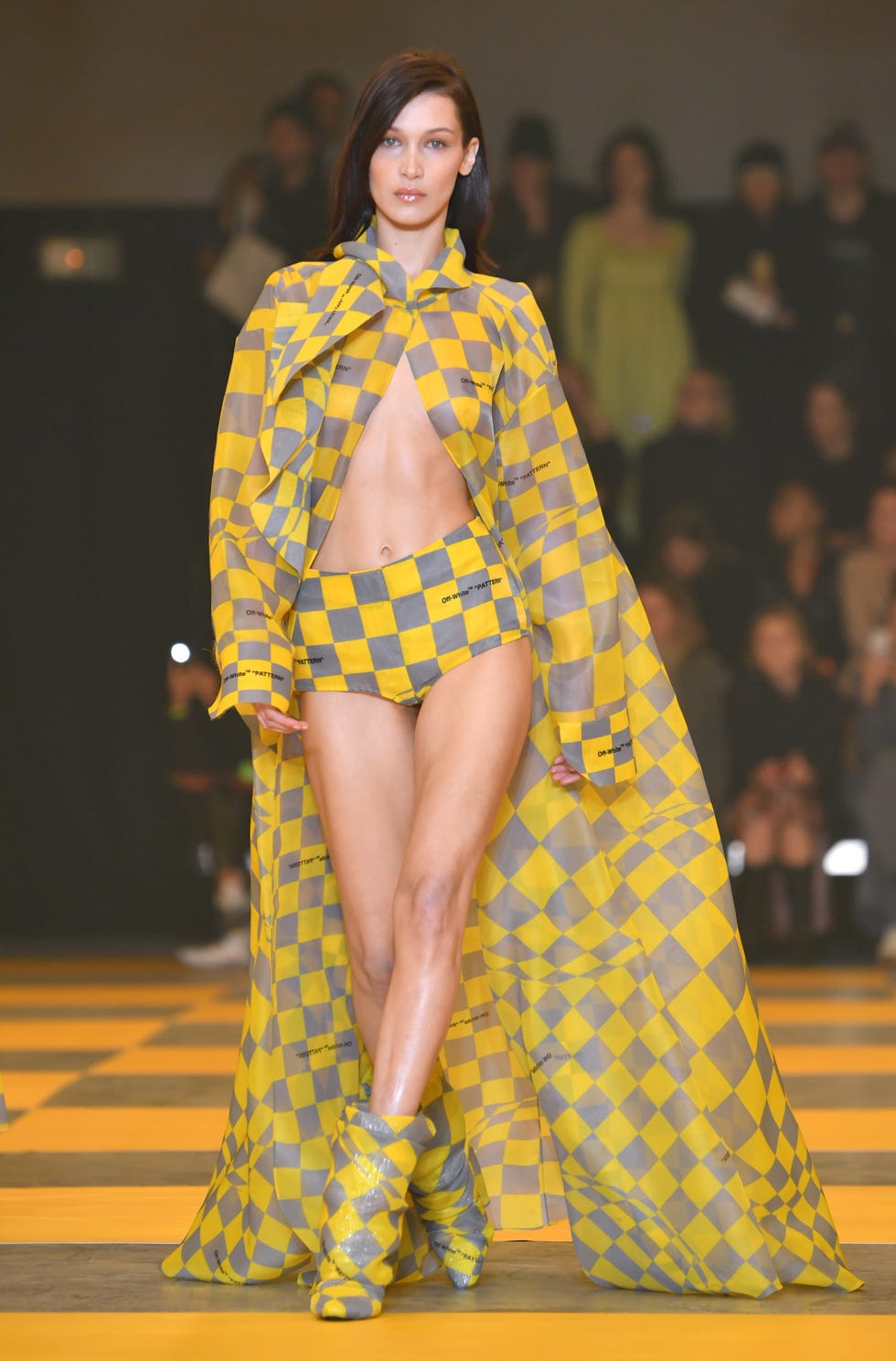 Fashion model, Clothing, Fashion, Fashion show, Yellow, Runway, Fashion design, Pattern, Haute couture, Design, 