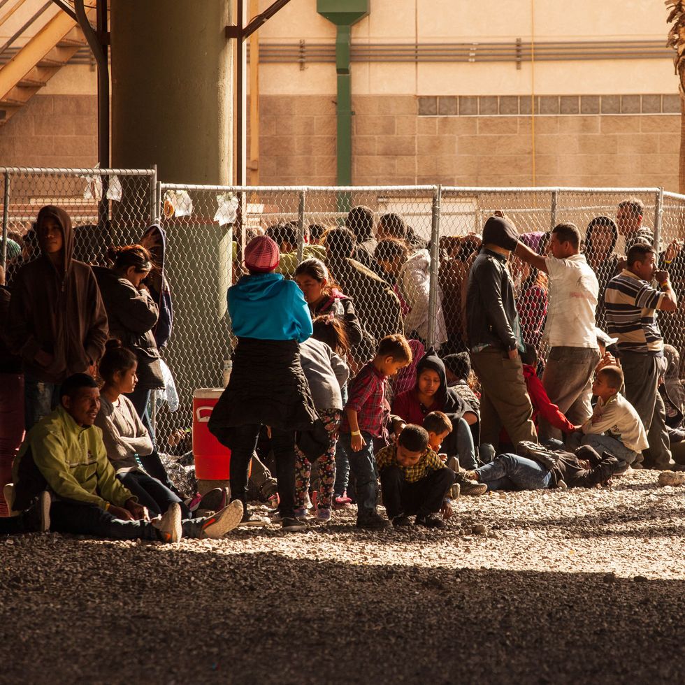 U.S. Customs And Border Protection Agency Holding Detained Migrants Under Bridge In El Paso